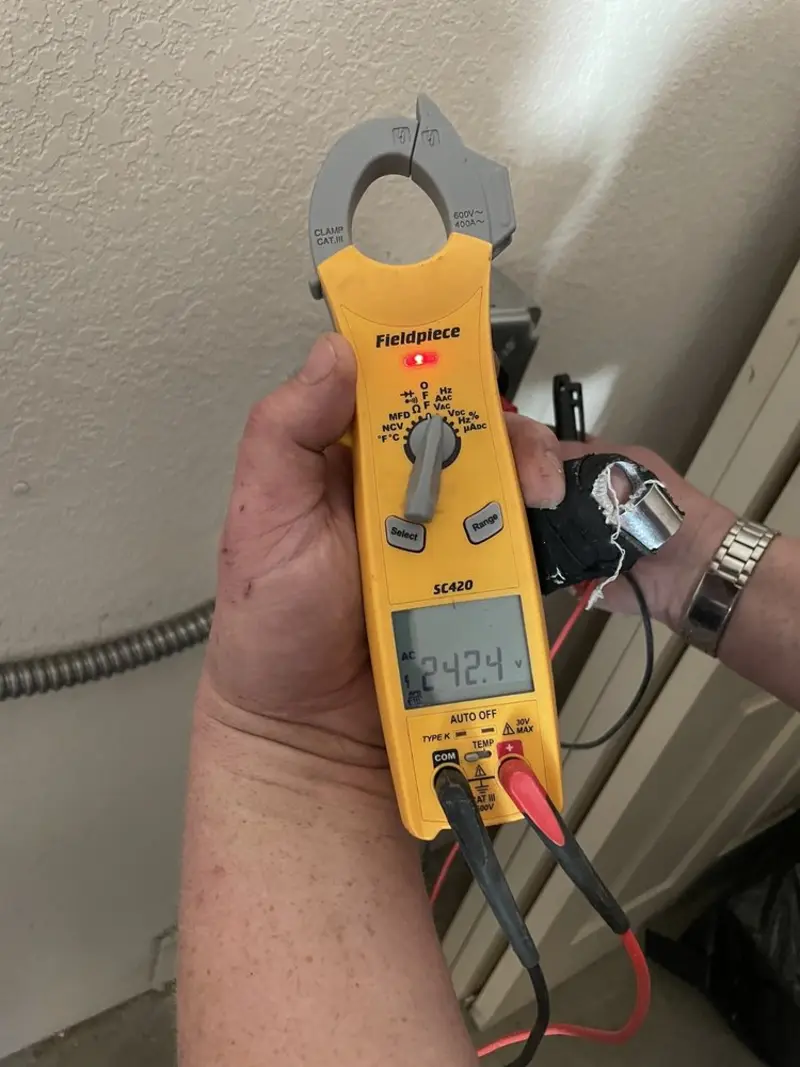 Voltage testing with clamp meter during Recessed Lighting Installation in Highland